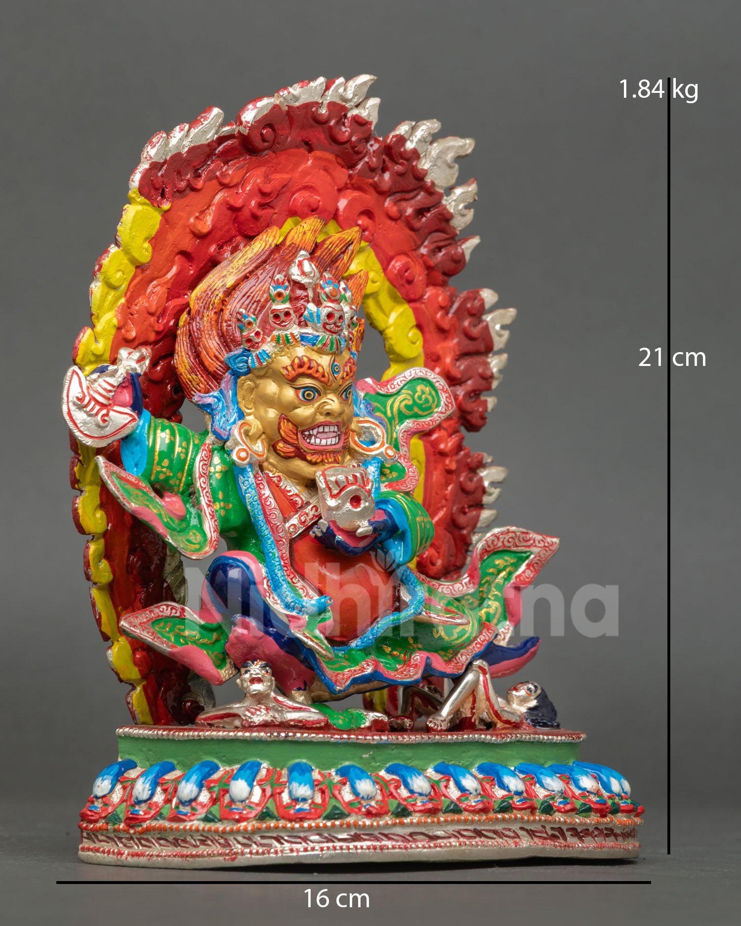 right view of mahakala bernagchen statue crushing evil deities on lotus throne
