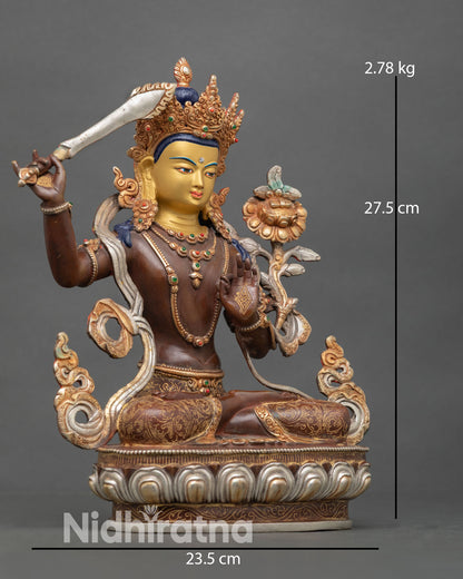 right view of oxidized copper manjushri statue with flaming wisdom sword