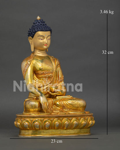 right view of shakyamuni buddha statue with lotus throne and sacred buddhist symbols