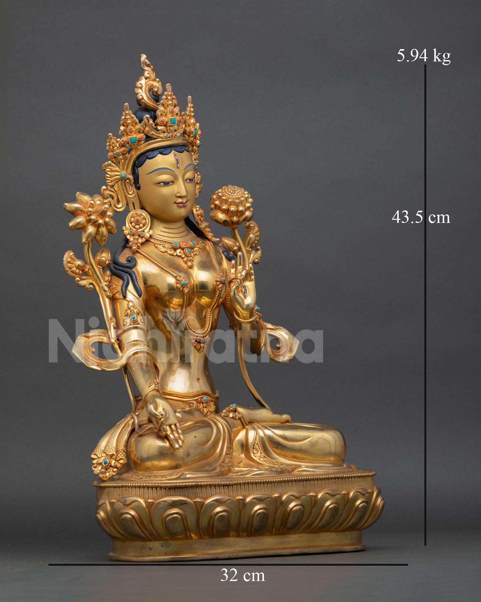 right view of white tara meditation statue with utpala flower and lotus base