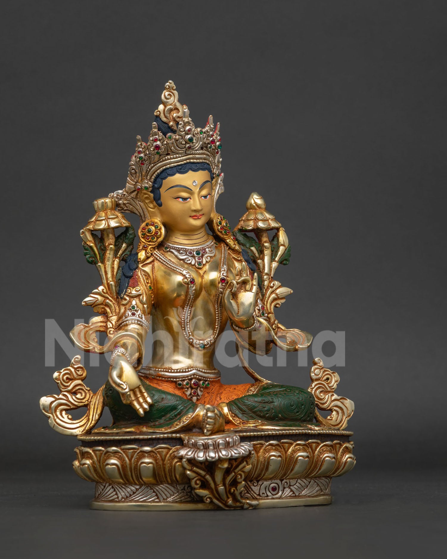 right view side of green tara statue with lotus and ornate jewelry