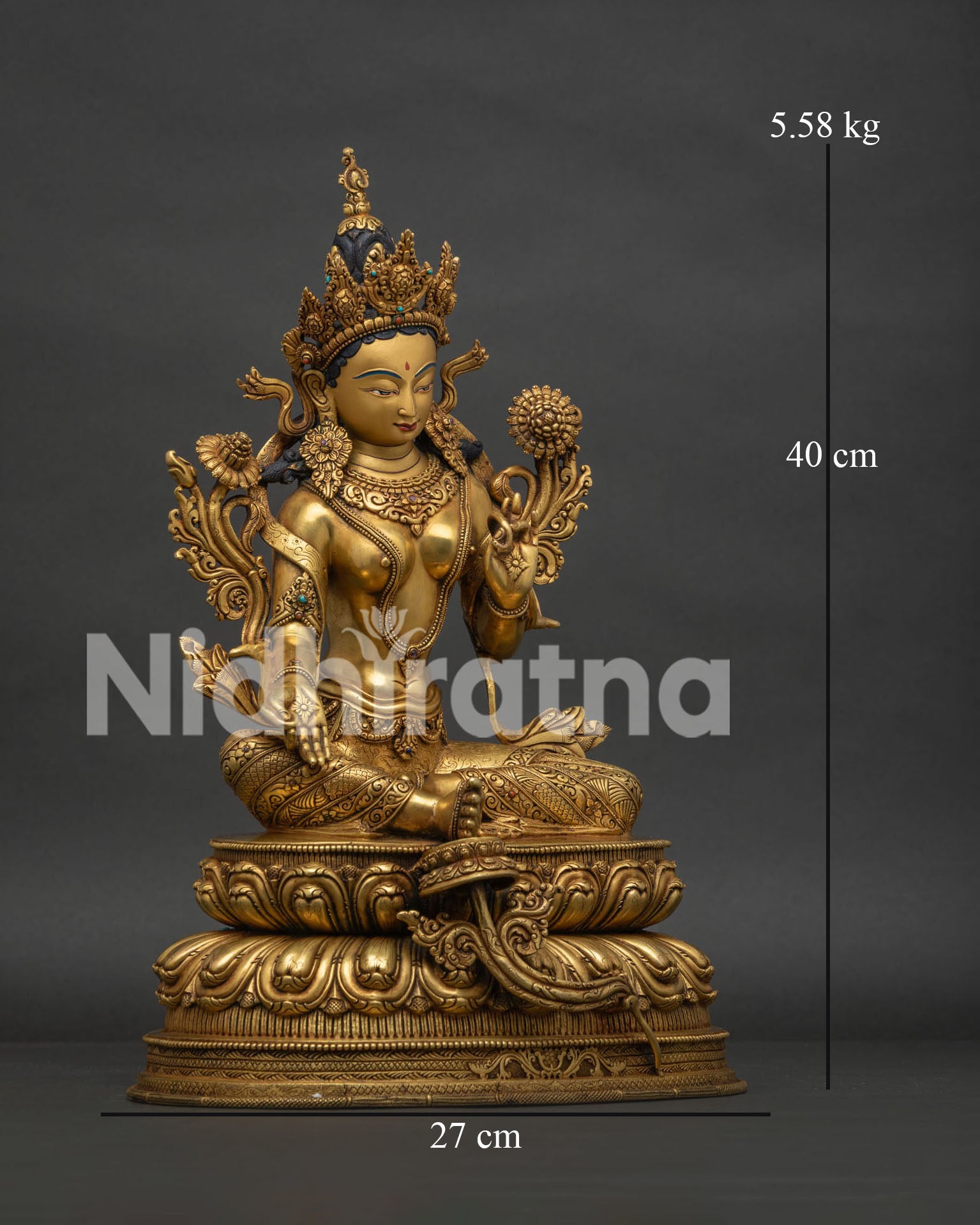 Right view side of Green Tara statue with traditional Buddhist artwork details