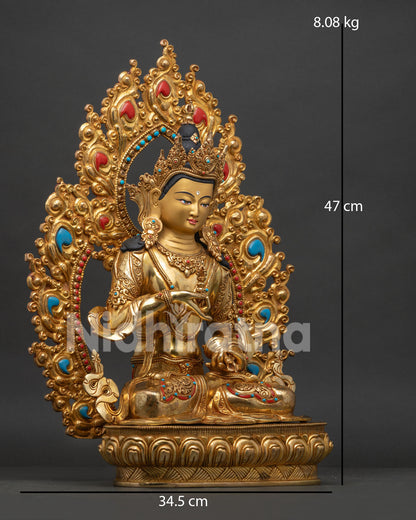 Right view side Vajrasattva statue showing vajra bell and traditional ornaments