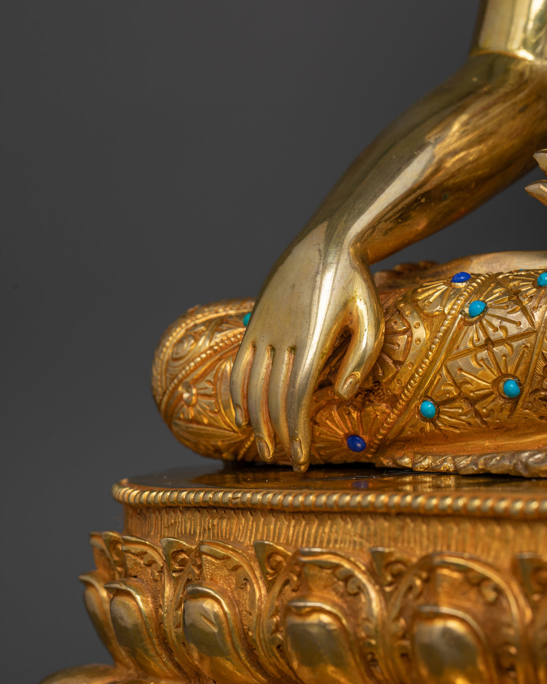 the right arm of gold plated shakyamuni buddha statue