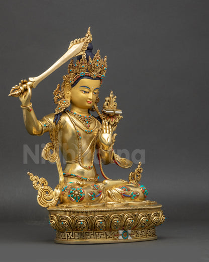 right view side of Manjushri statue showing flowing robes and lotus pedestal
