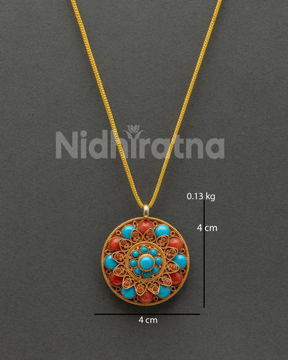 Round turquoise and coral flower locket with gold plated details from Nepal