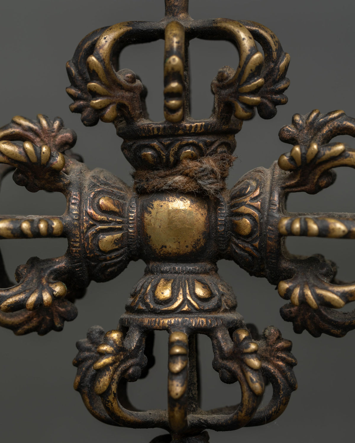 Sacred Bishow Vajra ritual object with intricate copper details and traditional oxidized finish for Buddhist altar.