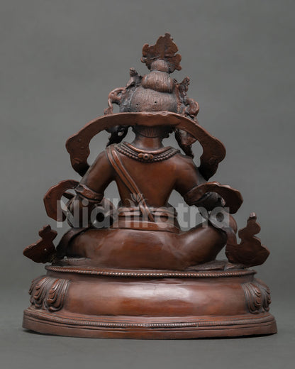dzambhala-statue-handcrafted-by-newar-artisan-from-patan-nepal-with-oxidized-copper-finish-and-lotus-pedestal.