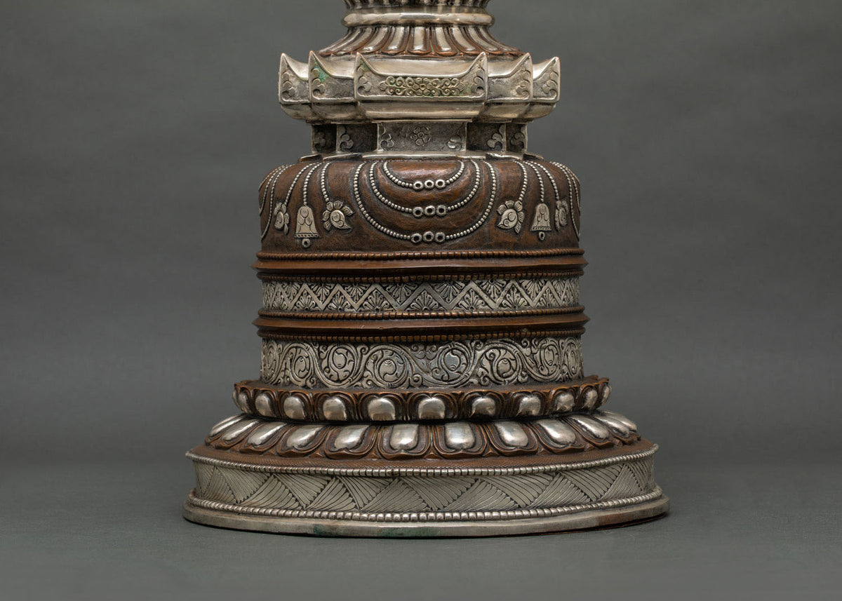Sacred Kadampa Stupa symbolizing enlightenment with detailed floral carvings by Newari artisans in Patan, Nepal