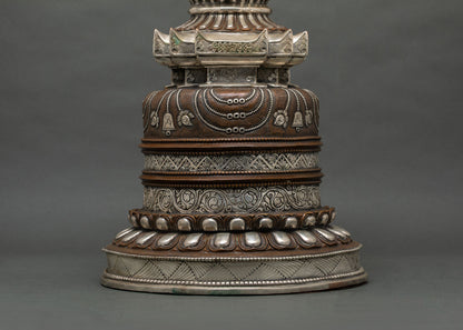 Sacred Kadampa Stupa symbolizing enlightenment with detailed floral carvings by Newari artisans in Patan, Nepal
