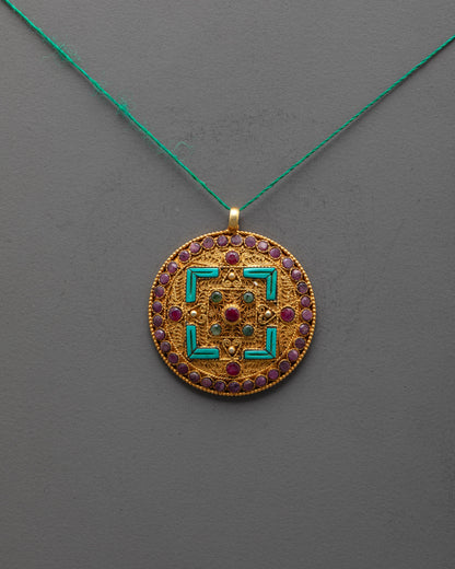 sacred mandala locket front view with gold-plated finish and intricate filigree design
