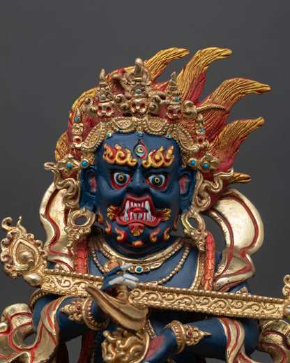 Sakya Mahakala close up fierce guardian face with hand painted details gold gilded copper Vajrayana protector deity statue.