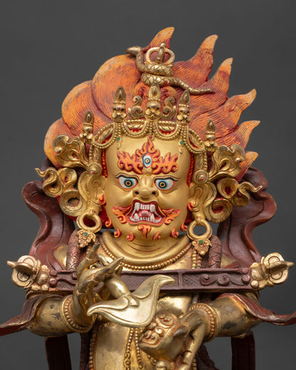 Sakya Mahakala statue close up view fierce expression Sakya Tibetan deity gold painted details sacred Buddhist art