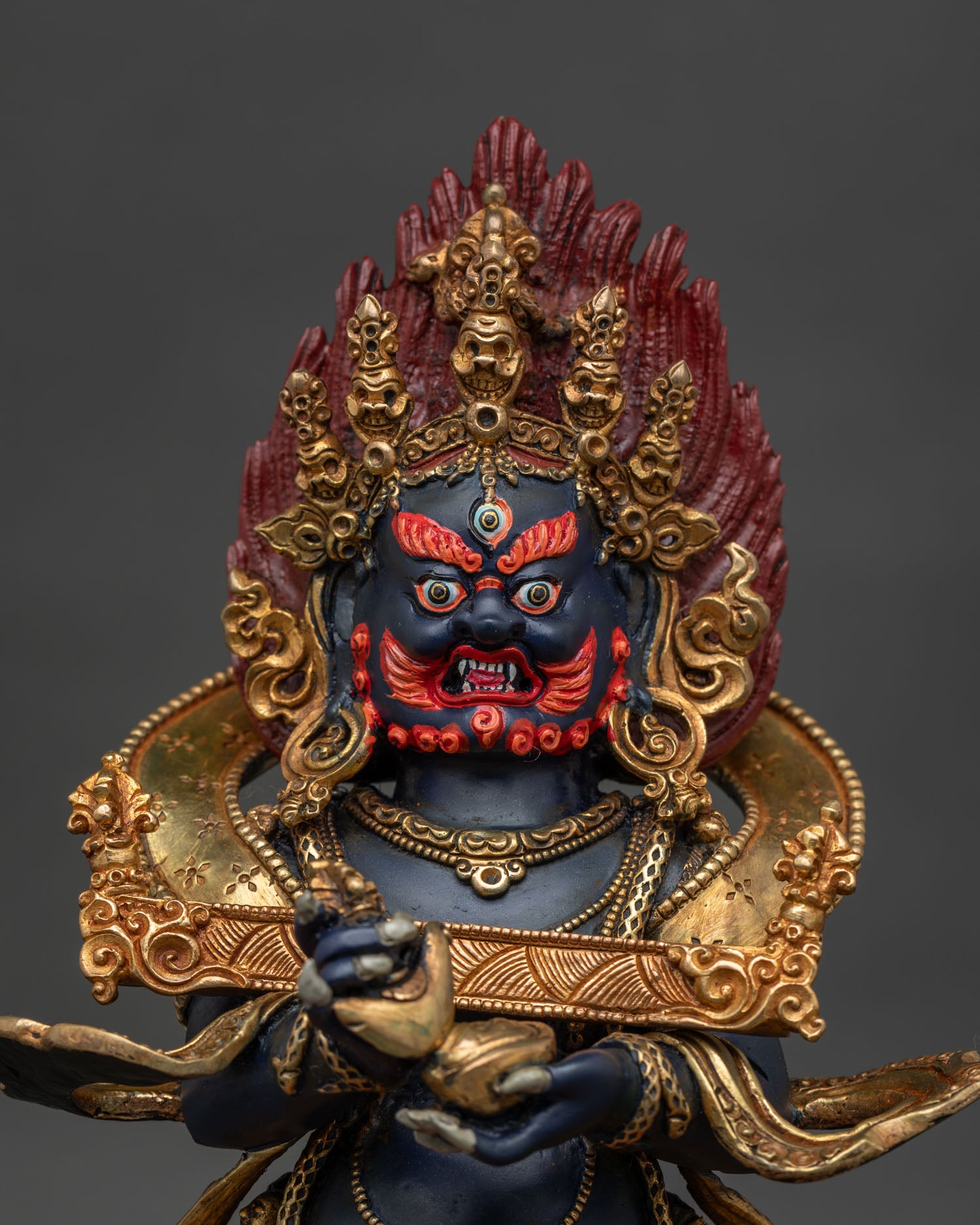 Sakya Mahakala statue holding kapala and kartika ritual knife.