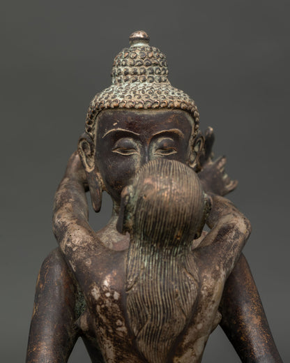 Samantabhadra with consort face close up showing serene expressions and intricate copper details.