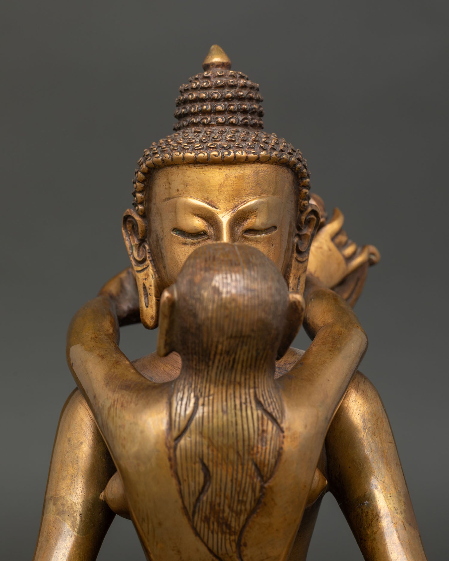 Samantabhadra with consort statue showing dhyana mudra and sacred iconography.