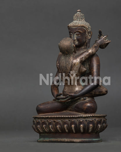 Samantabhadri holding Kartika knife and Kapala in sacred yab-yum posture side view.