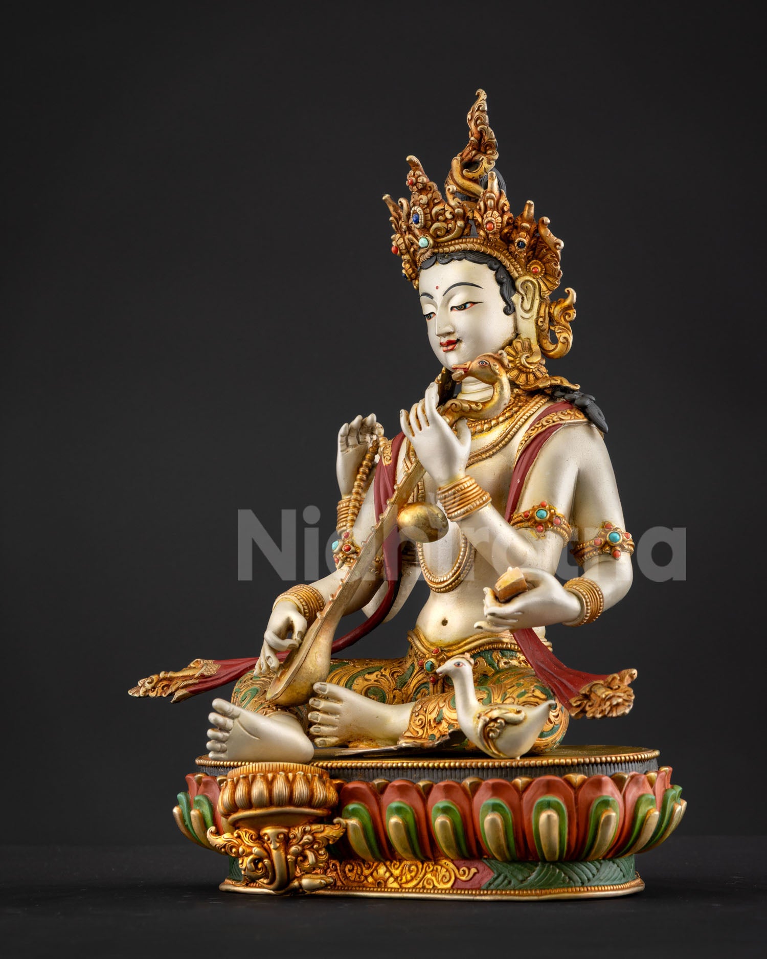 Saraswati goddess statue lotus throne swan symbol wisdom discernment traditional Himalayan lost wax bronze sculpture Nepal artisan craft