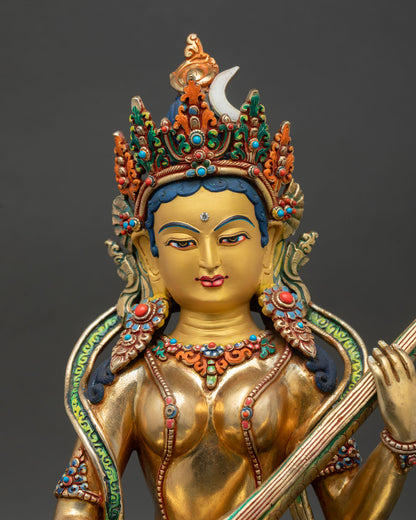 saraswati statue close up, gold gilded copper with semi precious stones detail