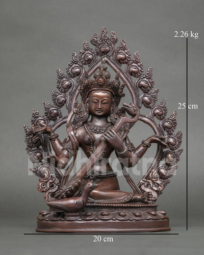 Saraswati Statue in copper with chemically oxidized finish front view.