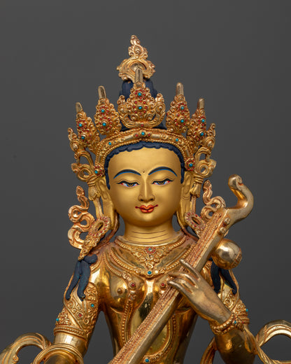 Saraswati Statue detailed face 24K gold finish and semi precious stones.