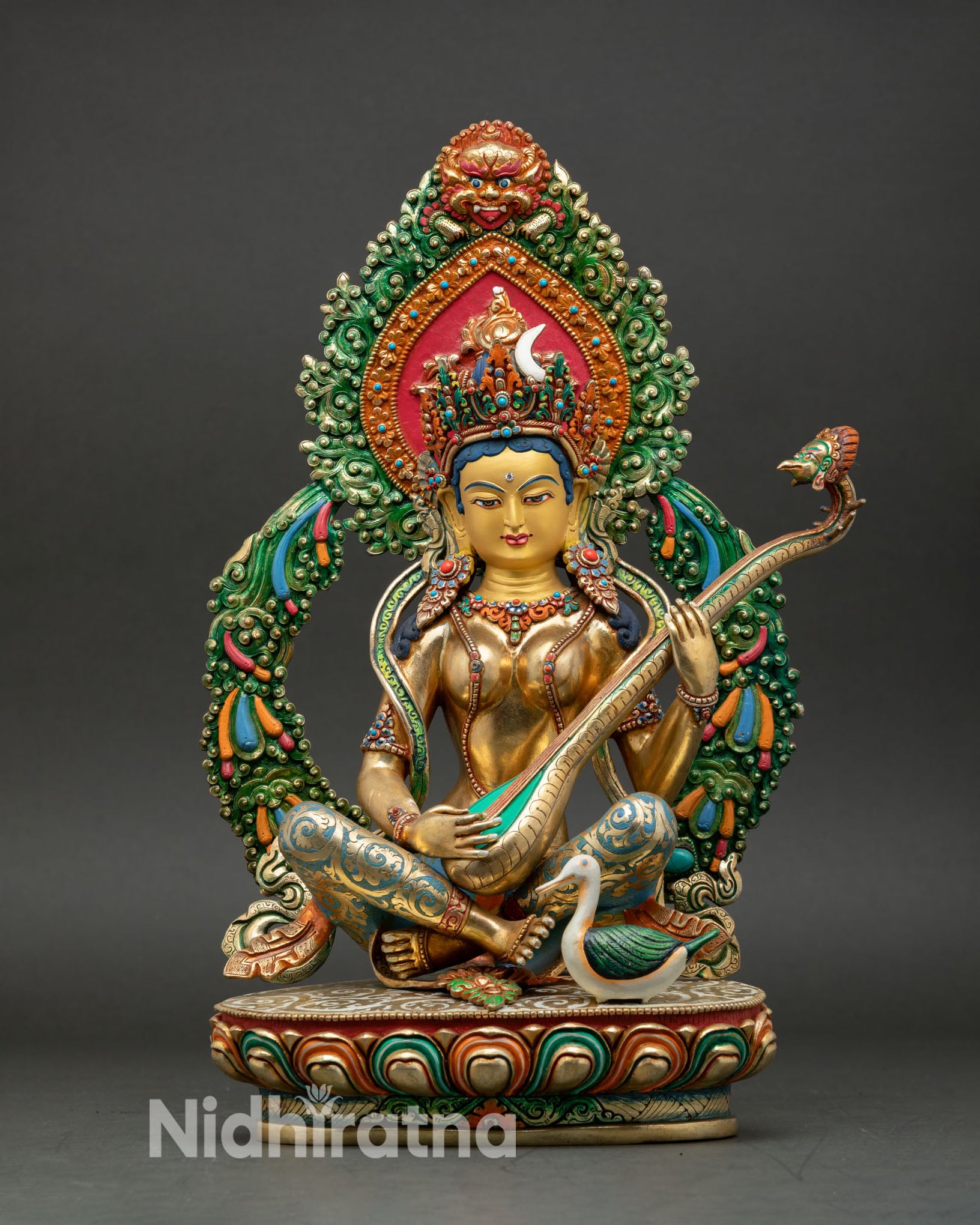 saraswati statue front view, copper gold fire gilded with lotus seat and vina