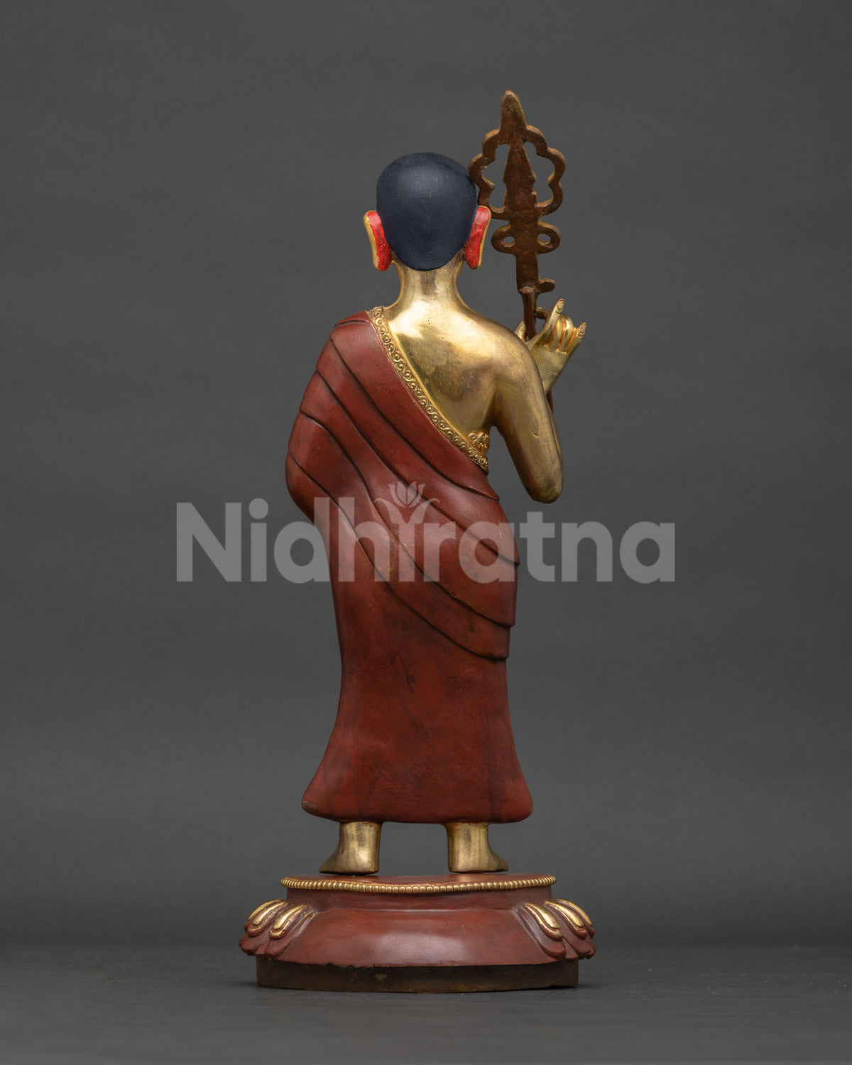 Sariputra statue back view, engraved robe and lotus pedestal detail