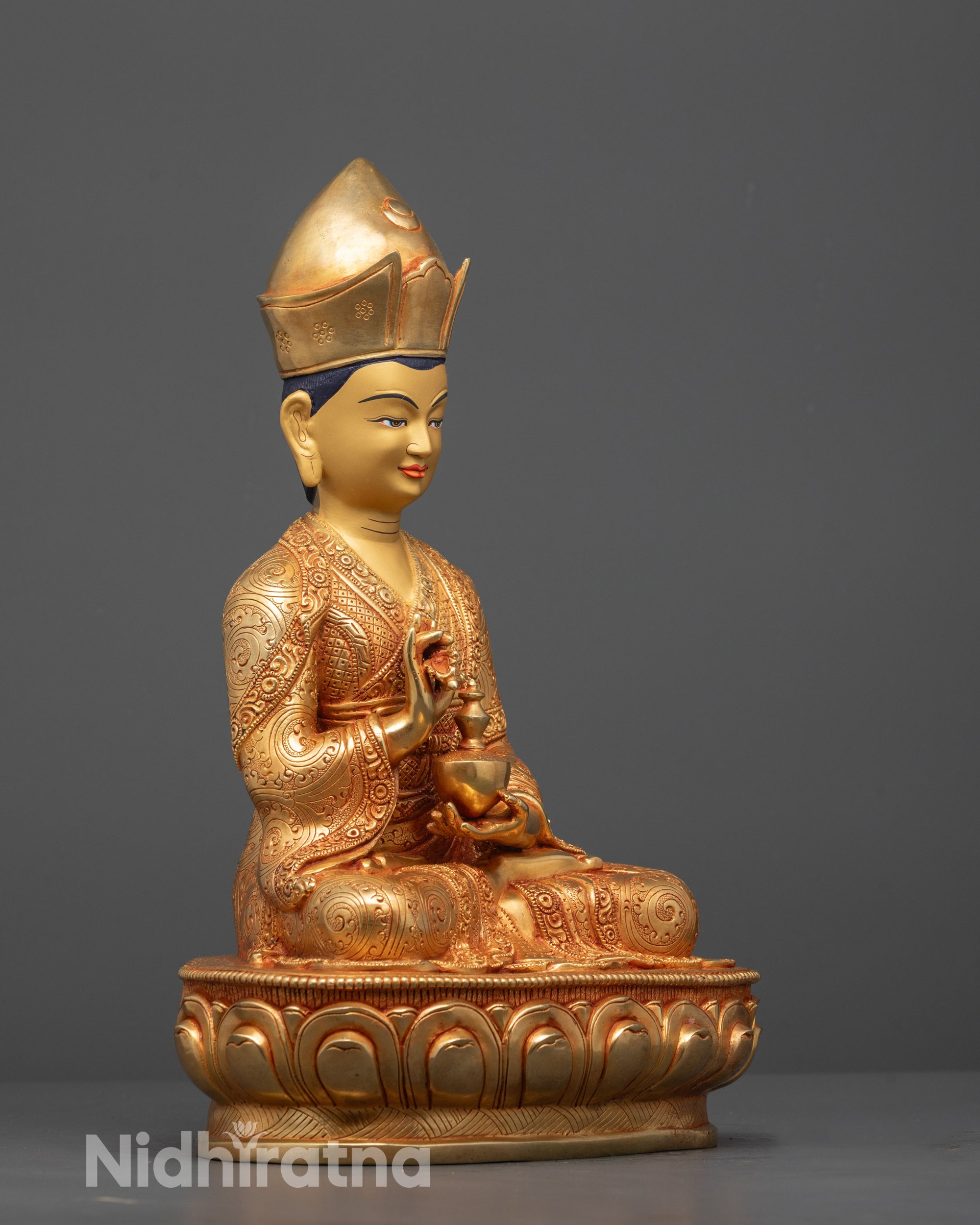 Rear view of Karmapa Statue showing detailed hand-carved robes