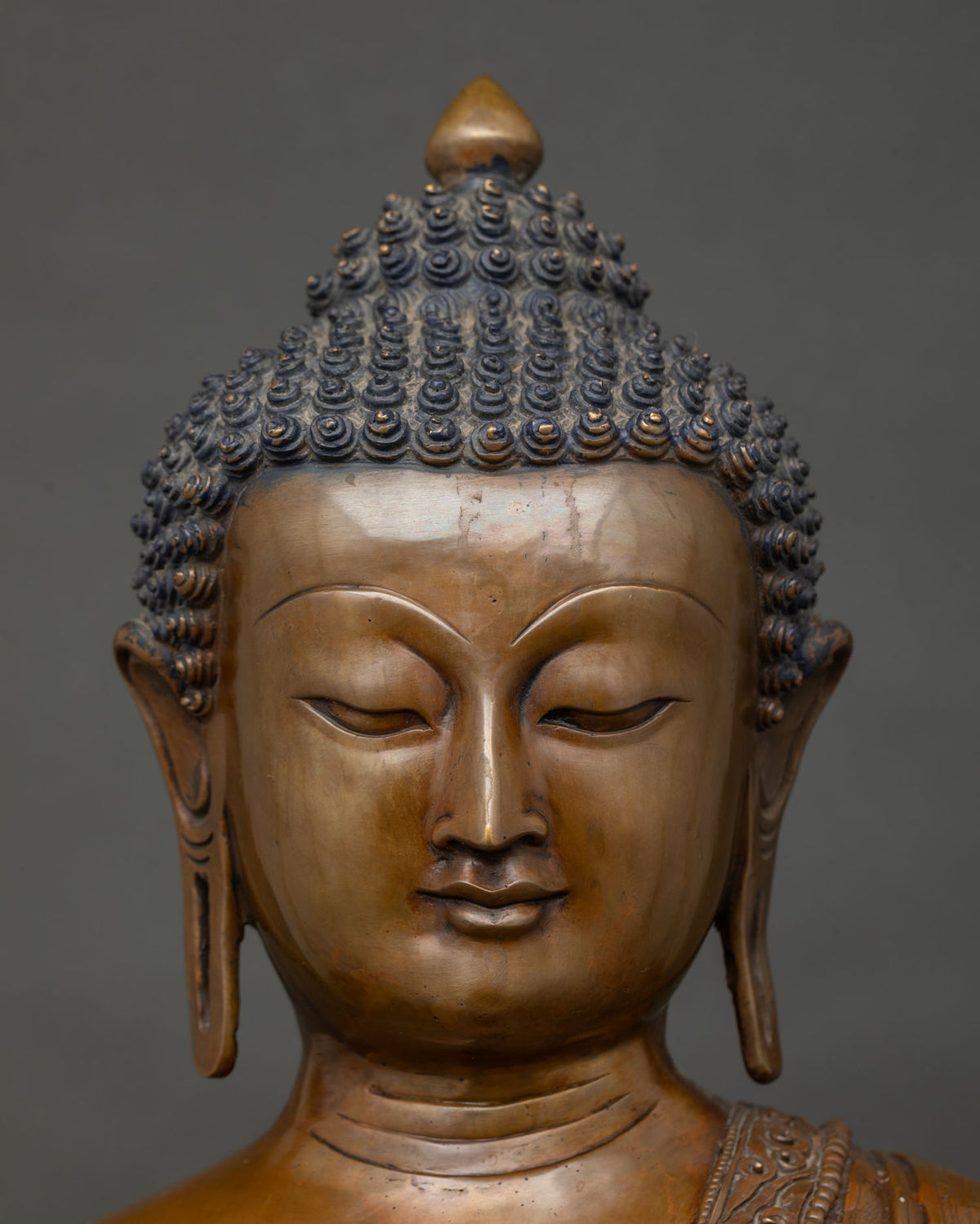 Serene Half Lidded Face of Oxidized Copper Shakyamuni Buddha Radiating Tranquility
