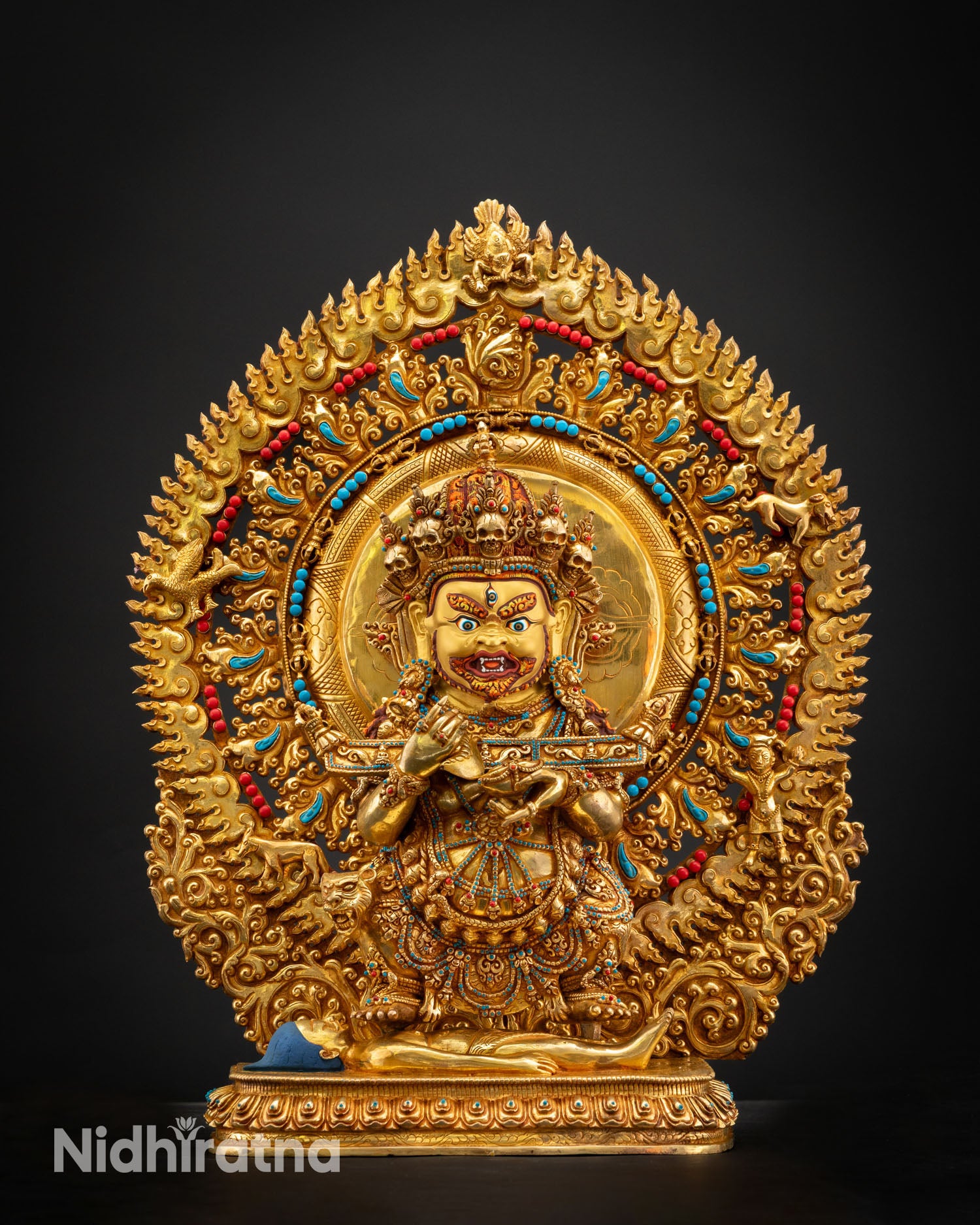 Shakya Mahakala close up fierce expression five skull crown gold gilded face Vajrayana wrathful deity detail handmade Nepal