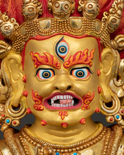 shakya mahakala statue face close up revealing fierce expression, 24k gold painted face, crown of five skulls and divine wrathful energy