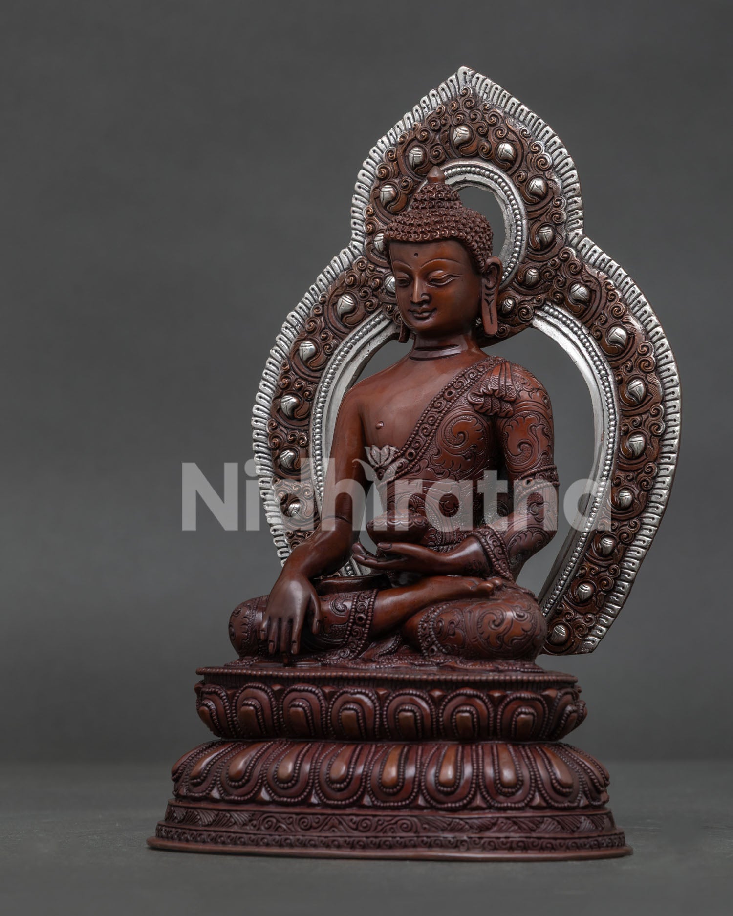 Shakyamuni Buddha Bhumisparsha Mudra holding begging bowl detailed view.