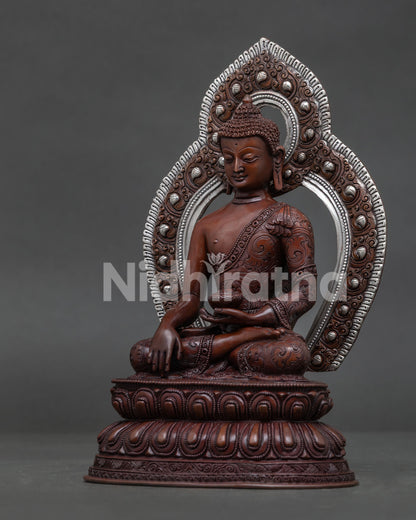 Shakyamuni Buddha Bhumisparsha Mudra holding begging bowl detailed view.