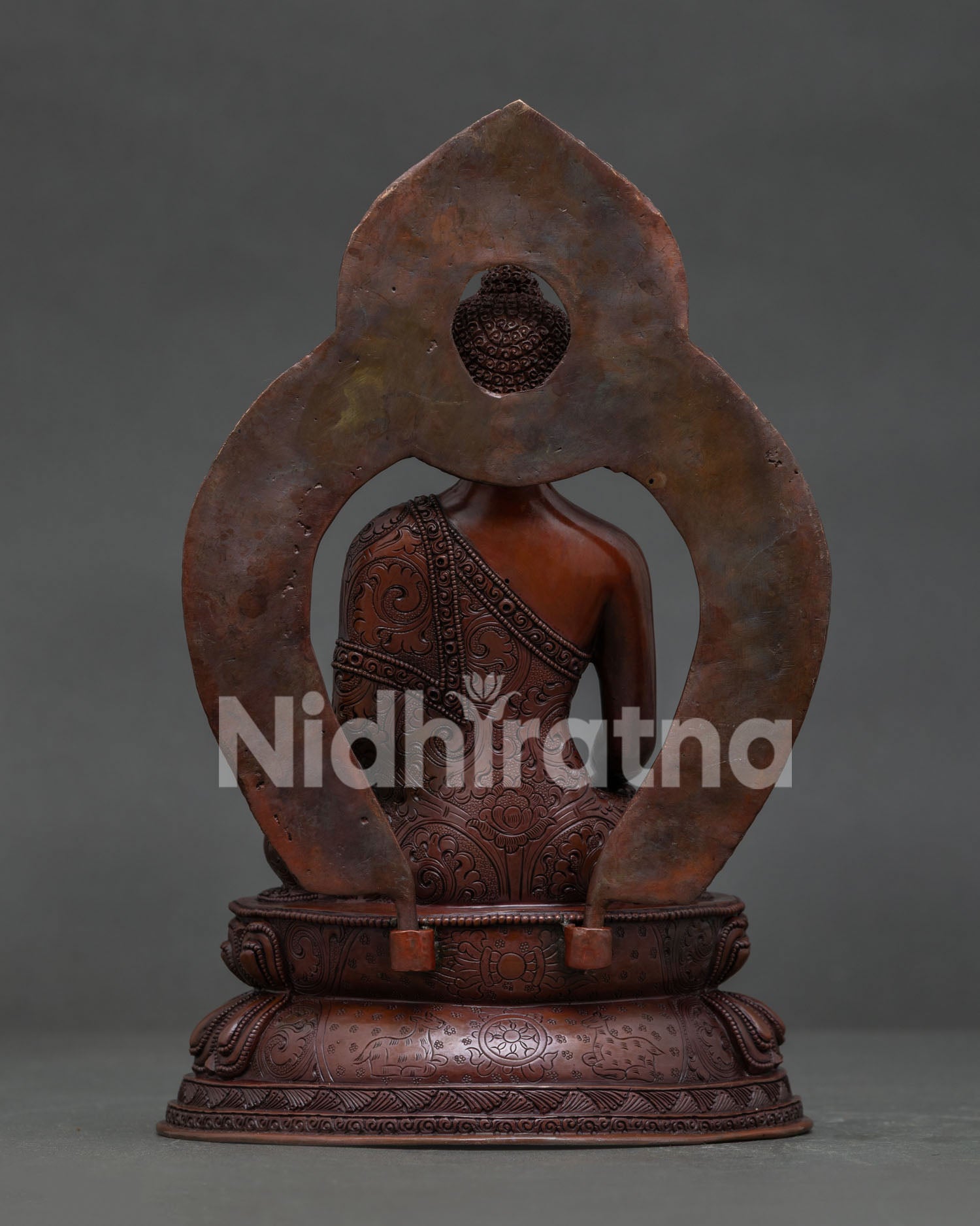 Shakyamuni Buddha double lotus throne with vajra dharma chakra and deer artwork.