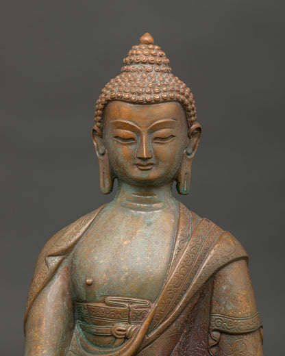 Shakyamuni Buddha face close up with detailed handcarved monk robe from Nepal.
