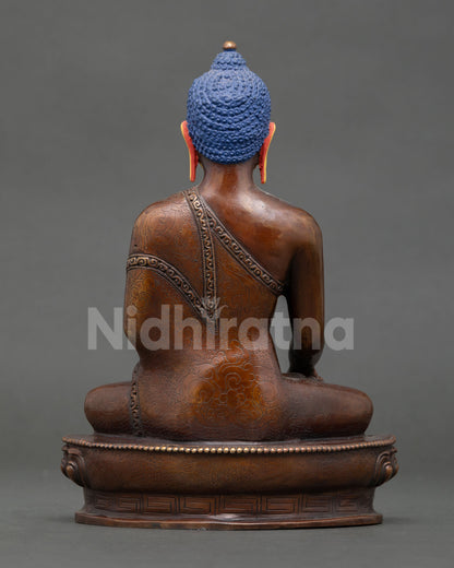 Shakyamuni Buddha meditation statue from Nepal featuring lotus throne, sacred mudra, and traditional Buddhist spiritual design.