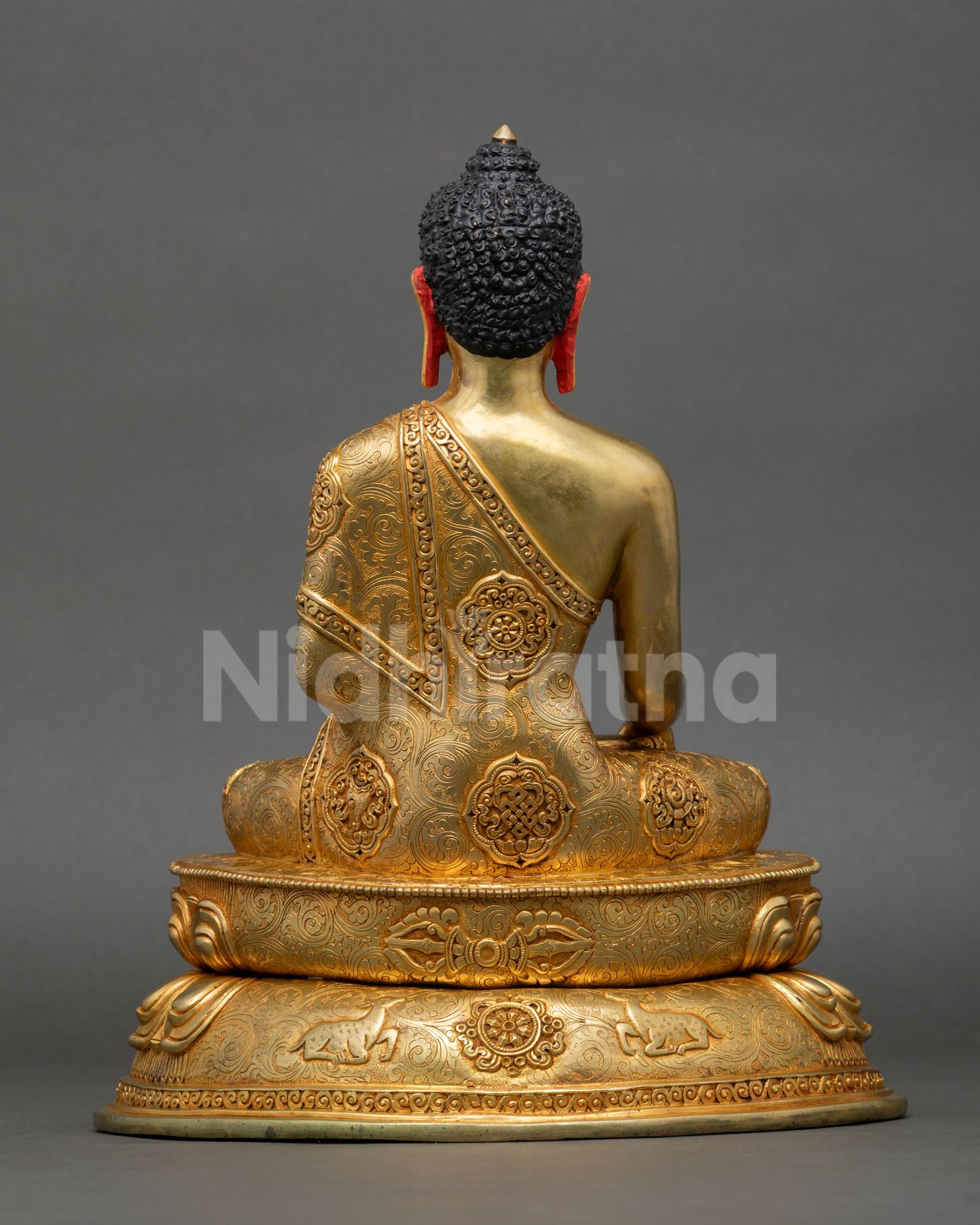 Shakyamuni Buddha meditation statue seated on a double lotus pedestal, monastic robe engravings, vajra, dharmachakra, deer, Nepal statue