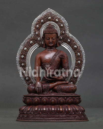 Shakyamuni Buddha oxidized copper statue with silver plated halo front view.