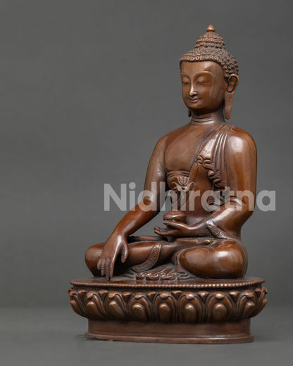 Shakyamuni Buddha sculpture displaying earth-touching mudra, begging bowl, lotus seat, and Himalayan Buddhist artistry.