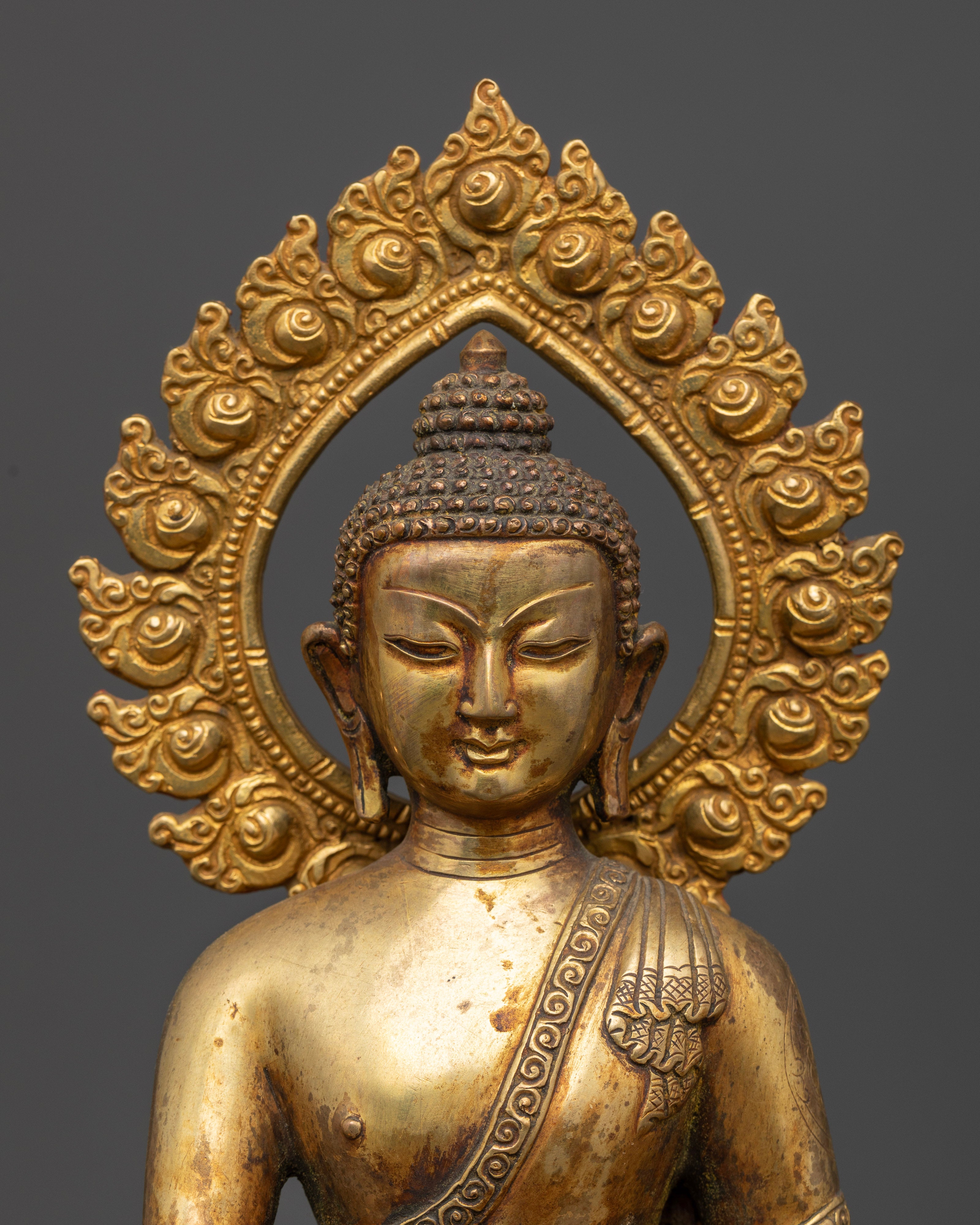 Shakyamuni Buddha sculpture with rising halo handcrafted Nepalese Buddhist art.