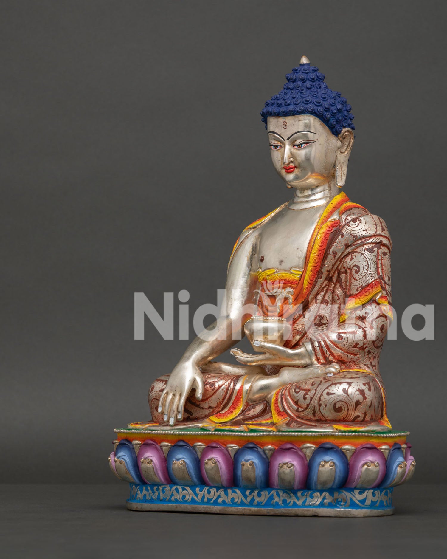 Shakyamuni Buddha sculpture with vibrant acrylic artwork made by Newari artisans in Nepal