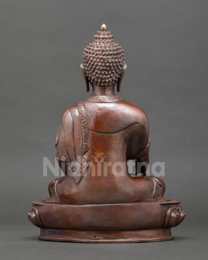 Shakyamuni Buddha seated in earth touching mudra on a lotus throne, a handmade meditation statue from Nepal for spiritual and Buddhist decor.