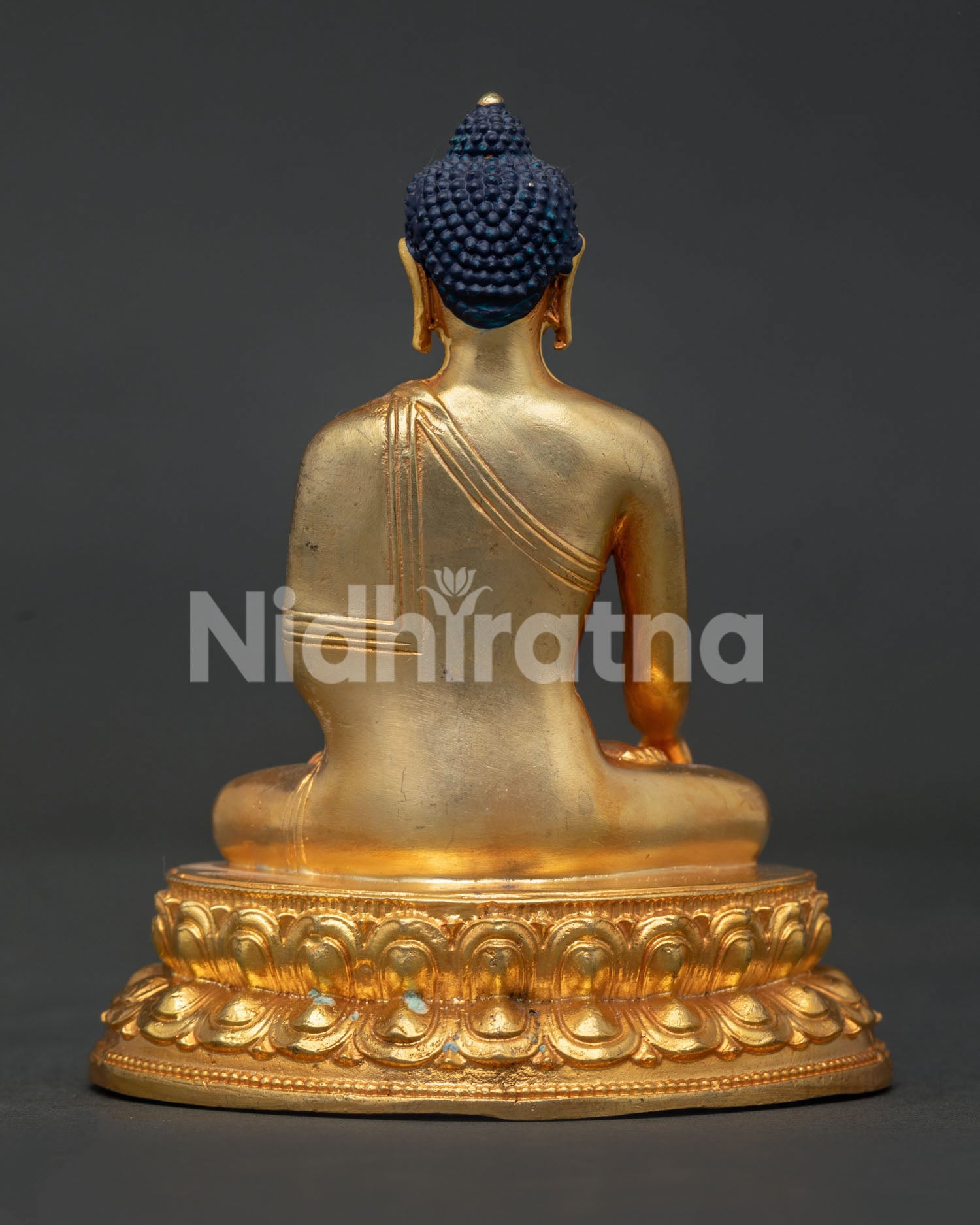 Shakyamuni Buddha seated on double lotus pedestal with gold gilded copper.