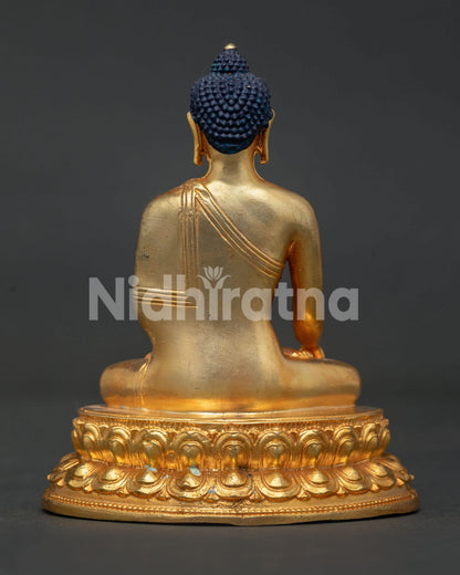 Shakyamuni Buddha seated on double lotus pedestal with gold gilded copper.