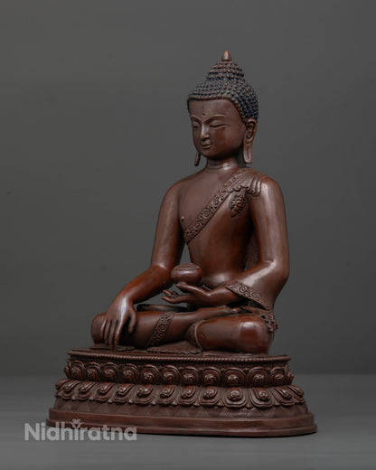 Shakyamuni Buddha seated on double lotus pedestal holding a patra bowl