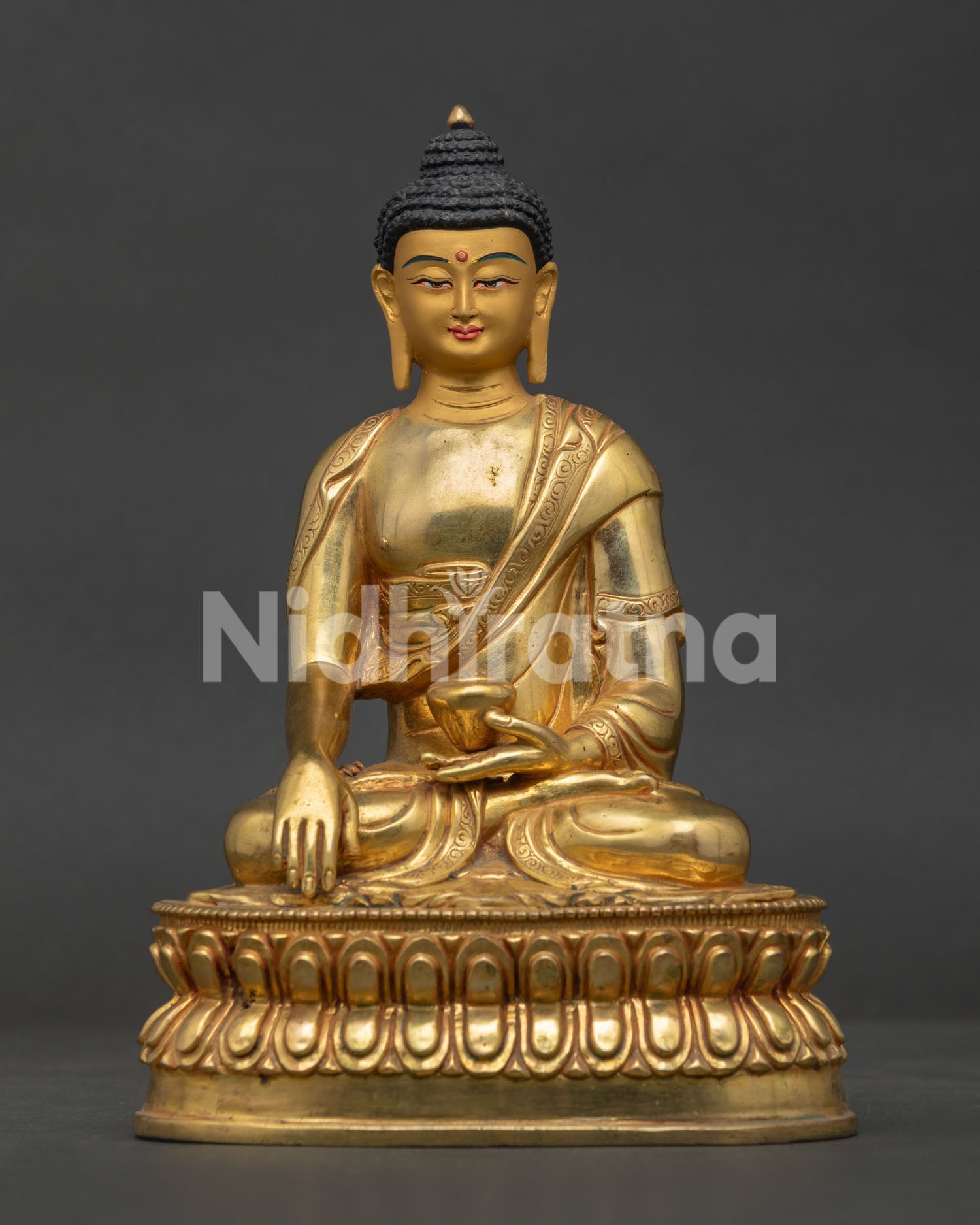 Shakyamuni Buddha. seated on double lotus throne in earth touching mudra with begging bowl