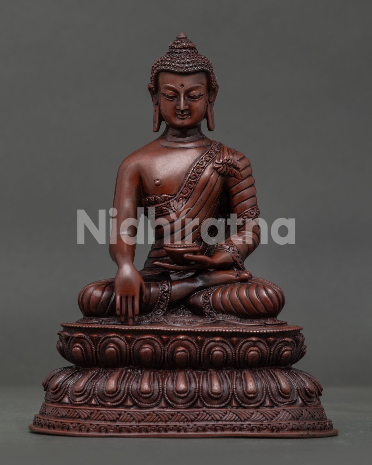 Shakyamuni Buddha seated on double lotus throne with earth touching mudra.