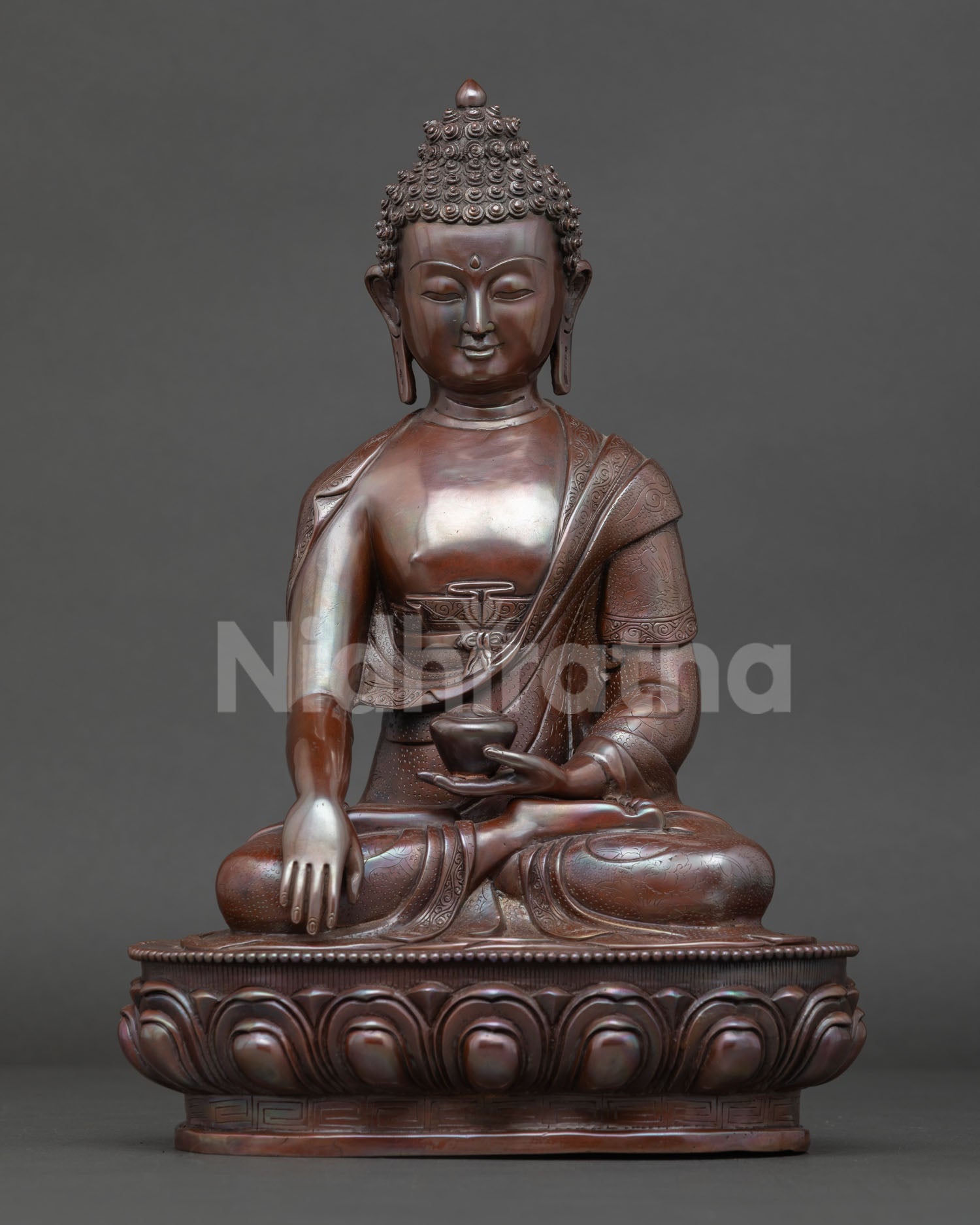 Shakyamuni Buddha seated on lotus throne in earth touching mudra holding begging bowl symbolizing enlightenment and wisdom.