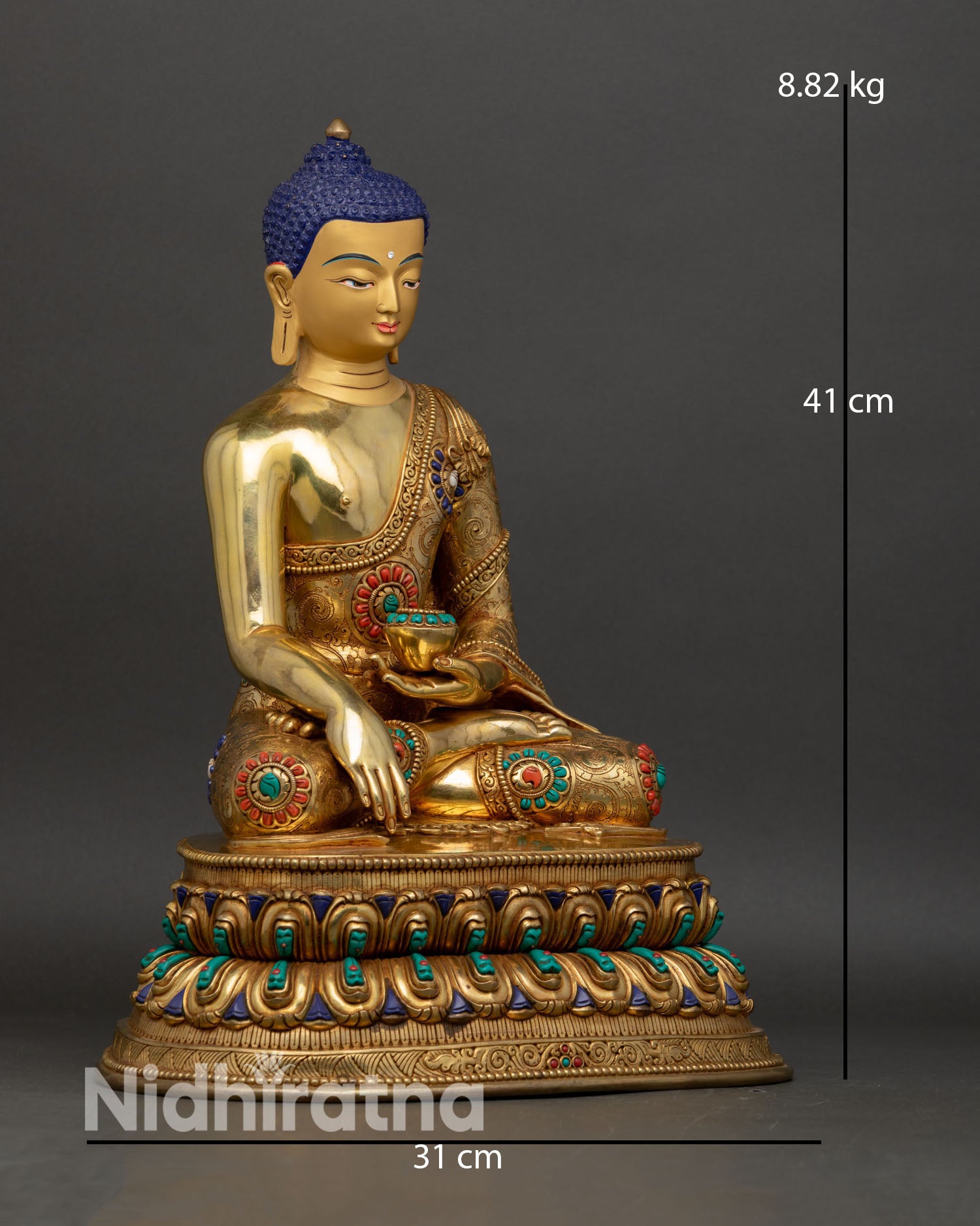 Shakyamuni Buddha side view showing gold fire gilded copper robe with three dimensional patterns and lotus pedestal