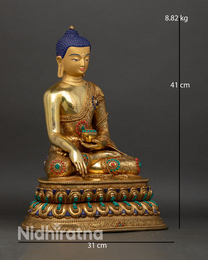 Shakyamuni Buddha side view showing gold fire gilded copper robe with three dimensional patterns and lotus pedestal